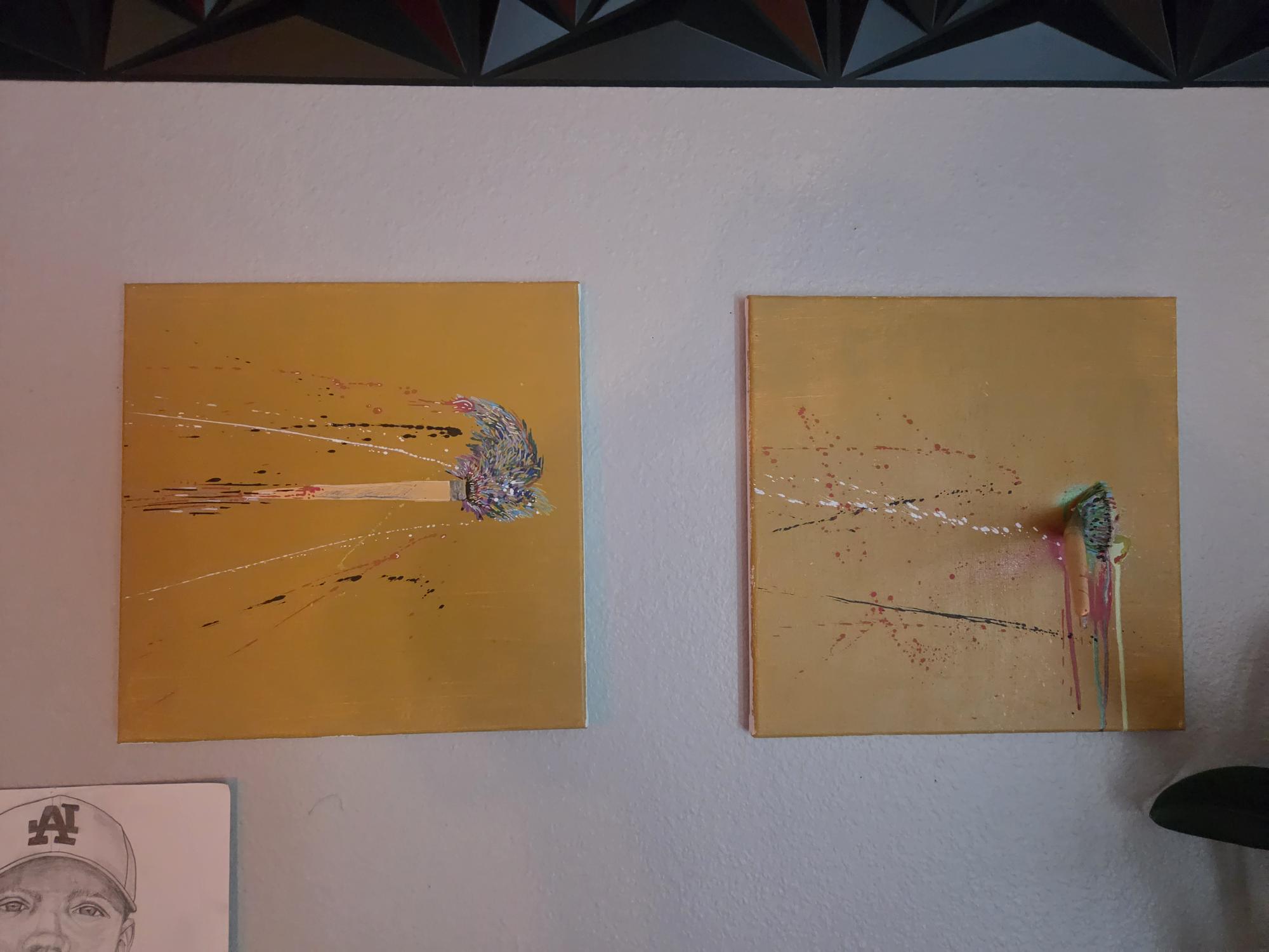 Two original gold canvas paintings with textured flowing forms.
